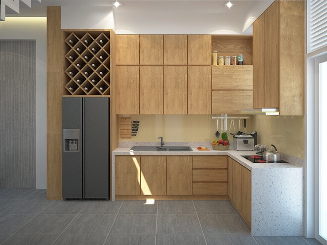 Mẫu thiết kế nhà ống 3 tầng, với khu vực bếp nằm phía sau nhà mở ra khu vườn nhỏ được trồng cây xanh.
