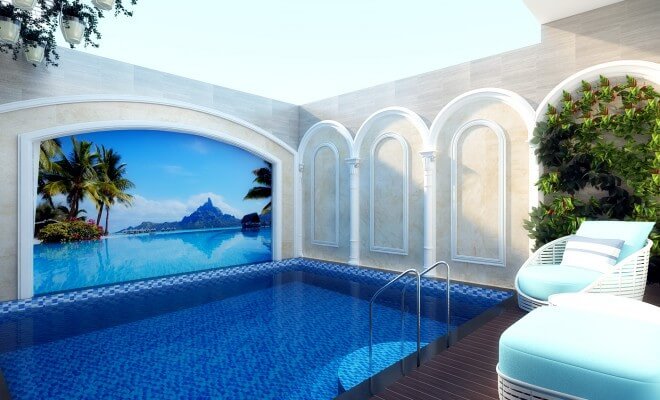 Hồ bơi gia đình được trang trí bằng tranh tường đại dương xanh, tạo cảm giác gần gũi với thiên nhiên, trong thiết kế nhà 5 tầng này.